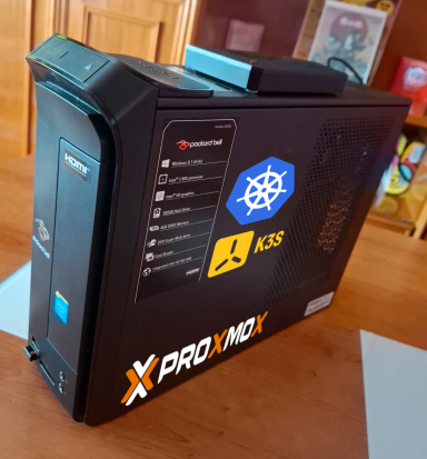 Packard Bell computer close-up with Proxmox VE, K3s and K8s logos